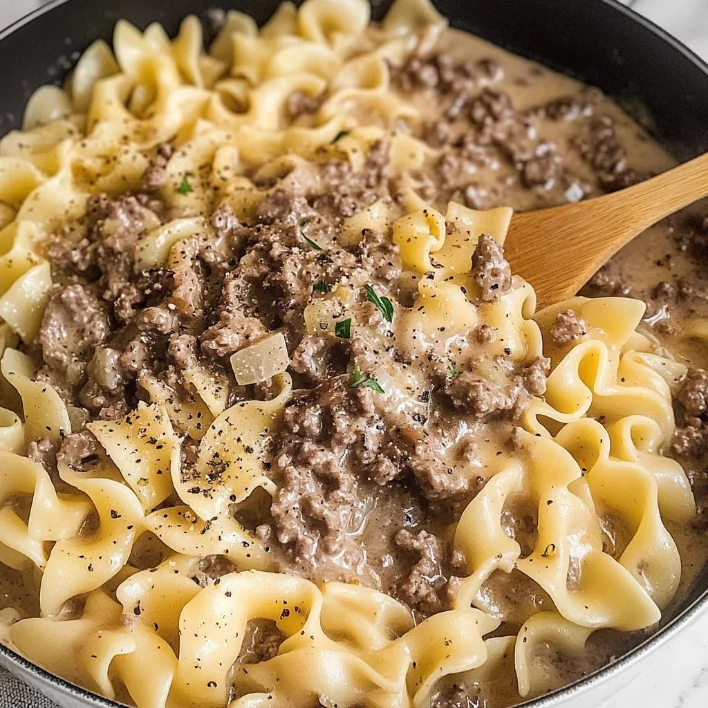 Quick 30-minute beef stroganoff served in a bowl with noodles and mushrooms.