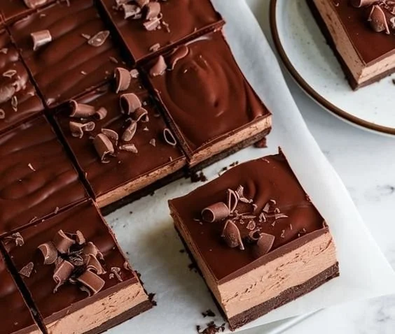 Decadent Chocolate Mousse Brownies topped with creamy chocolate mousse layer.
