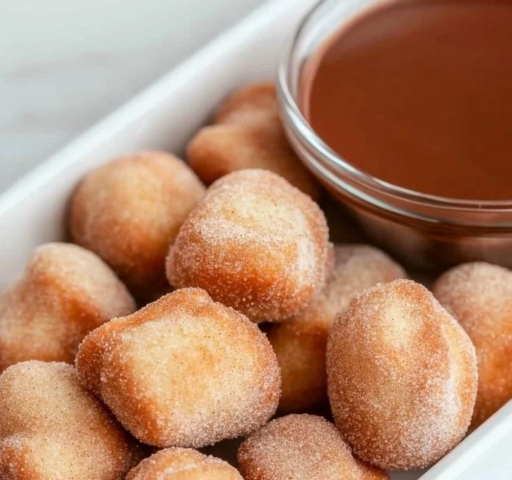 Crispy air fryer churro bites served with a chocolate dipping sauce